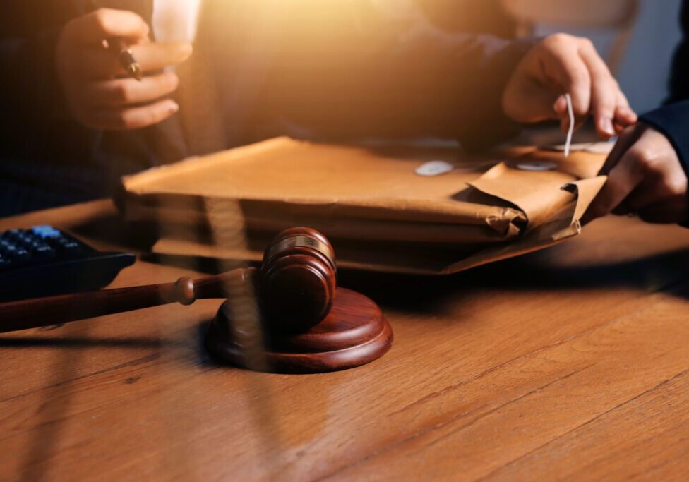 Gavel on table with legal documents