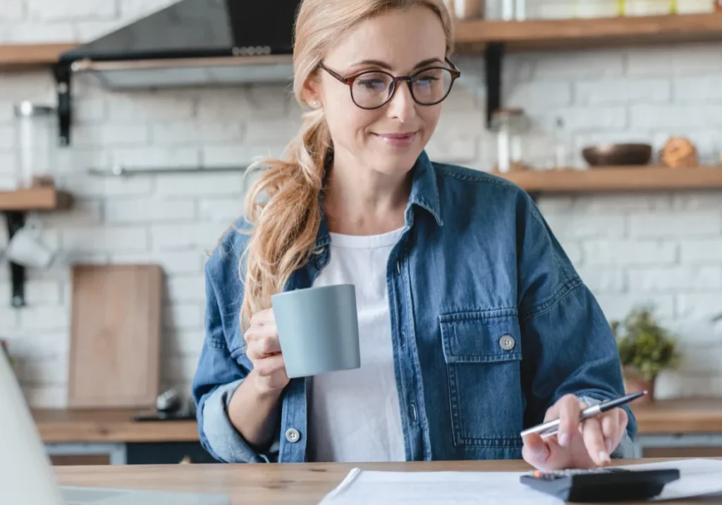 Woman working with coffee in kitchen